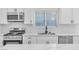 Close up of newly renovated kitchen with stainless appliances and bright white cabinets at 6248 Spanish Moss Ave, Las Vegas, NV 89108