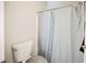 Clean bathroom showcases a toilet, shower with curtain, and a neutral color palette at 6901 Squaw Mountain Dr # 201, Las Vegas, NV 89130