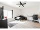 Spacious bedroom with large window, ceiling fan, and modern decor for a comfortable retreat at 6901 Squaw Mountain Dr # 201, Las Vegas, NV 89130