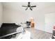 Bright bedroom offers a ceiling fan and a doorway view of a bathroom at 6901 Squaw Mountain Dr # 201, Las Vegas, NV 89130
