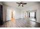 Bedroom featuring laminate floors, mirrored closet doors, and an en suite bathroom at 6901 Squaw Mountain Dr # 201, Las Vegas, NV 89130