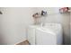 Laundry room featuring white washer and dryer, plus a shelf for laundry supplies at 6901 Squaw Mountain Dr # 201, Las Vegas, NV 89130