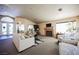 Living room with fireplace and a view of the gym through glass doors at 6901 Squaw Mountain Dr # 201, Las Vegas, NV 89130