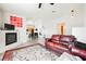 Bright living room featuring an inviting fireplace, a modern ceiling fan and neutral colored walls at 6901 Squaw Mountain Dr # 201, Las Vegas, NV 89130