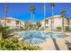 Community pool and spa with palm trees, creating a relaxing and luxurious atmosphere at 6901 Squaw Mountain Dr # 201, Las Vegas, NV 89130
