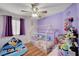 Cozy bedroom with whimsical bedframe, fan, and playful decor at 713 Salt Flats Cir, Henderson, NV 89011