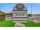 South Valley Ranch community entrance sign with decorative rocks and artificial turf landscaping at 713 Salt Flats Cir, Henderson, NV 89011