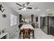 Spacious dining area with a large table, a ceiling fan, and an open layout connecting to the kitchen at 713 Salt Flats Cir, Henderson, NV 89011