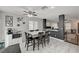 Bright dining area features a ceiling fan, modern decor, and easy access to the kitchen and living spaces at 713 Salt Flats Cir, Henderson, NV 89011