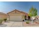 Charming single-story home with a two-car garage and a meticulously landscaped front yard at 713 Salt Flats Cir, Henderson, NV 89011
