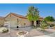 Well-maintained single-story house featuring desert landscaping, a front porch, and a two-car garage at 713 Salt Flats Cir, Henderson, NV 89011