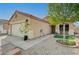 Cozy single-story home with a front porch, xeriscaping, and a two-car garage at 713 Salt Flats Cir, Henderson, NV 89011