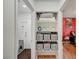 Convenient hallway with storage shelves leading to the laundry room and a bedroom at 713 Salt Flats Cir, Henderson, NV 89011