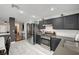 Well-lit kitchen boasts stainless steel appliances, modern cabinets, and seamless transition to the dining area at 713 Salt Flats Cir, Henderson, NV 89011