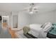 Large main bedroom featuring wood-look floors and access to attached bathroom at 713 Salt Flats Cir, Henderson, NV 89011