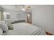 Bright and spacious main bedroom features wood-look floors and ensuite bathroom at 713 Salt Flats Cir, Henderson, NV 89011