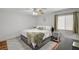 Relaxing main bedroom features wood-look floors and a neutral color scheme at 713 Salt Flats Cir, Henderson, NV 89011