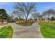 Lush community park featuring walking paths, mature trees, and green spaces for recreation at 713 Salt Flats Cir, Henderson, NV 89011