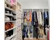 Organized walk-in closet featuring custom shelving and rods for ample storage of clothing and accessories at 713 Salt Flats Cir, Henderson, NV 89011