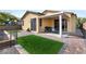 Well-maintained backyard with artificial turf, pavers, and a covered patio area at 7348 Zion Falls St, Las Vegas, NV 89131
