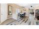 Elegant dining room features modern light fixture, comfortable seating, and seamless flow into the living space at 7348 Zion Falls St, Las Vegas, NV 89131