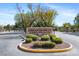 Welcome to Savannah Falls community entrance with manicured landscaping and stone signage at 7348 Zion Falls St, Las Vegas, NV 89131