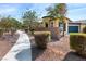 Charming home featuring xeriscape landscaping, lush shrubs, and a two-car garage at 7348 Zion Falls St, Las Vegas, NV 89131