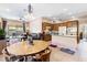 Open layout seamlessly blends kitchen, dining, and living areas, offering comfortable seating and modern functionality at 7348 Zion Falls St, Las Vegas, NV 89131
