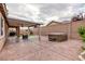 Private backyard featuring a covered patio and hot tub, perfect for outdoor relaxation at 7525 Campbell Ranch Ave, Las Vegas, NV 89179