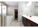 Bathroom with dual sinks, a walk-in closet, a soaking tub, and a separate shower stall at 7525 Campbell Ranch Ave, Las Vegas, NV 89179