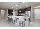 Gourmet kitchen with granite island, stainless appliances and breakfast bar for easy meals at 7525 Campbell Ranch Ave, Las Vegas, NV 89179