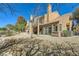 Charming exterior view featuring a tile roof, well-maintained desert landscaping and multiple balconies at 7636 Sudan Ct, Las Vegas, NV 89149
