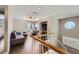 Cozy loft area with wood floors, comfortable seating, and a view outside at 7636 Sudan Ct, Las Vegas, NV 89149