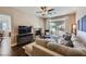 Cozy living room features a fireplace and sliding glass doors to the backyard at 7636 Sudan Ct, Las Vegas, NV 89149