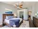 Serene primary bedroom suite boasts a ceiling fan and ensuite bathroom at 7636 Sudan Ct, Las Vegas, NV 89149
