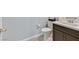 Bathroom featuring a dark wood vanity and tile floor at 788 Grand Country Ave, North Las Vegas, NV 89086