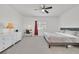 Comfortable bedroom with a plush bed, stylish dresser, vanity, and neutral color palette at 788 Grand Country Ave, North Las Vegas, NV 89086
