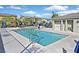Community pool with lounge chairs and umbrellas for residents at 788 Grand Country Ave, North Las Vegas, NV 89086