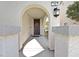Inviting front porch entrance featuring an arched entryway and decorative wreath at 788 Grand Country Ave, North Las Vegas, NV 89086