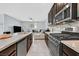 Modern kitchen with granite countertops, stainless steel appliances, and convenient island seating at 788 Grand Country Ave, North Las Vegas, NV 89086