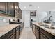 Bright kitchen featuring granite countertops, stainless steel appliances, and a kitchen island at 788 Grand Country Ave, North Las Vegas, NV 89086