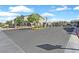 Street view of a gated community featuring landscaping and well-maintained roads at 788 Grand Country Ave, North Las Vegas, NV 89086