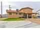 Home's backyard featuring a covered patio, gravel area, greenery, and a two story home at 8504 Soneto Ln, Las Vegas, NV 89117