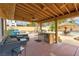 Outdoor living space featuring a covered patio, built-in grill, and a private pool area at 8504 Soneto Ln, Las Vegas, NV 89117