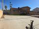 Spacious backyard featuring a covered patio, desert landscaping, and a concrete pad at 8504 Soneto Ln, Las Vegas, NV 89117
