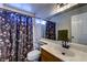 Bathroom with a shower and bath combination, and a floral shower curtain at 8504 Soneto Ln, Las Vegas, NV 89117