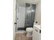 Bathroom with a black and white tiled shower at 8504 Soneto Ln, Las Vegas, NV 89117