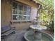 Charming courtyard featuring a decorative water fountain and ambient string lights creating a peaceful retreat at 8504 Soneto Ln, Las Vegas, NV 89117