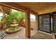 Charming courtyard featuring a decorative water fountain and ambient string lights for a cozy atmosphere at 8504 Soneto Ln, Las Vegas, NV 89117
