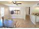 Bright dining area featuring views of the modern kitchen, staircase, and bar area at 8504 Soneto Ln, Las Vegas, NV 89117